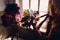 Woman in brazilian samba carnival costume with colorful feathers plumage relax in old entrance with big window