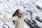 Woman breathing fresh air in the mountain in winter