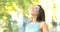 Woman breathing fresh air in the street