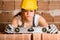 Woman Bricklayer with Spirit Level