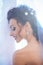 Woman with bridal veil on brunette hair. Happy bride smile on wedding day. Sensual woman with professional makeup