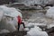 Woman in bright erd raincoat near the Glacier Lagoon, Iceland