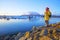 Woman in bright yellow raincoat near the Glacier Lagoon