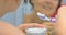 Woman brightening teeth with bicarbonate