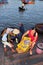 A Woman is bringing fresh fishes upstair to a local seafood market in Vinh Luong port