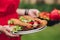 Woman bringing fresh sandwiches. Close-up of unrecognizable woman carrying delicious homemade sandwiches on plates