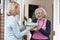 Woman Bringing Meal For Elderly Neighbour