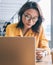 Woman browsing smartphone in workspace