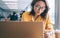 Woman browsing smartphone in workspace