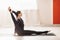 Woman brunette practicing yoga, performing the yantrasana exercise, compass pose