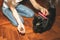 Woman is brushing black cat. Pet grooming. Fur shedding. Happy animal