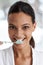 Woman, brushing teeth and toothbrush for dental, portrait with smile in bathroom for morning routine. Oral hygiene