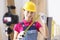 Woman builder blogger tells camera how to make measurements correctly during repair