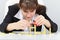 Woman building a tower on table with domino