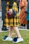 Woman with Bulgari blue bag and yellow tartan skirt before Emporio Armani fashion show, Milan Fashion Week