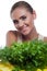 Woman with bundle herbs (salat)