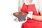 Woman with bundt cake and red apron