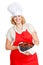 Woman with bundt cake wearing a red apron