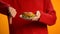 Woman with burger on plate showing thumbs down, fast food obesity, health care