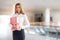 Woman in business center with folder in hands