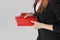 Woman business lady in black suit with red diary planner in hands