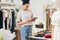 Woman business owner with digital tablet in a boutique. Saleswoman working in a retail store