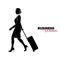 Woman in business suit. Businesswoman comes with a suitcase