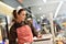 Woman butcher weighing sausages