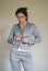 Woman Buttoning or Unbuttoning Suit