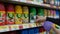 Woman buying air wick freshmatic inside Walmart store