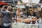 Woman buying cakes at Greenwich Market, London, UK