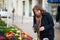 Woman buying flowers on a Parisian flower market