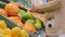 Woman buying fresh exotic citrus fruits at grocery store