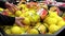 Woman buying fresh lemon