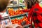 Woman buying fresh tomato vegetables