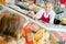 Woman buying at meat counter