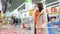 Woman buying meat in supermarket during pandemic