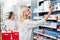 Woman Buying Medicine in Pharmacy