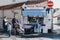 Woman buying seafood from Joyful Wests Shellfish Bar in Sheringham, Norfolk, UK