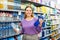 Woman buying still water in supermarket