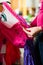 Woman is buying Tracht or dirndl in a shop