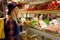 Woman Buying Turkish Sweets At Eastern Food Market