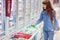 Woman buying vegetables in frozen section