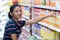 Woman buys a juice in the supermarket