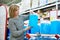 Woman buys nonfreezing liquid in supermarket