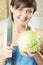 Woman with cabbage and knife