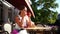 Woman cafe coffee on the street. A woman sits at a table in a street cafe in summer and drinks coffee with a croissant