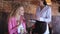 Woman at cafe drinking coffee with chocolate candies