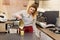 Woman, cafe worker pouring fresh pineapple fruit cocktail