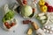 Woman came back from a market and unpacks a reusable grocery bag full of vegetables on a kitchen at home. Zero waste and